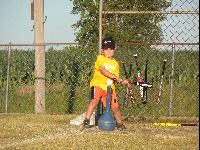 Boy Playing T-Ball